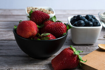 Selective targeting of containers with seeds, blueberries and strawberries.