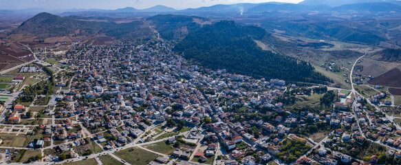 Aerial view around the city Farsala in Greece on a sunny day in autumn.