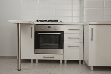 New gas stove and oven in stylish kitchen