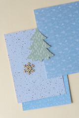 wooden snowflake and tree on holiday cards