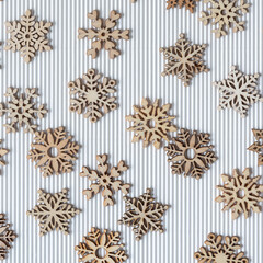 wooden snowflakes on corrugated paper