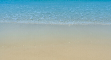 Fototapeta na wymiar Abstract sand of beach and soft ocean wave background