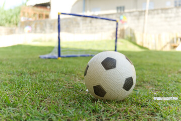 soccer ball on the grass focus on foreground