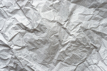 verso side of rough packing or wrapping paper with decorative print