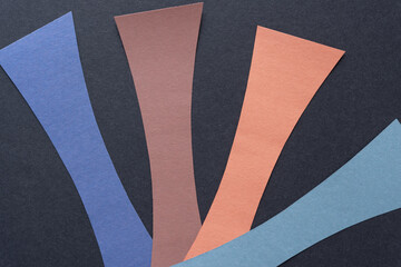 construction paper stripes with concave profile on black paper