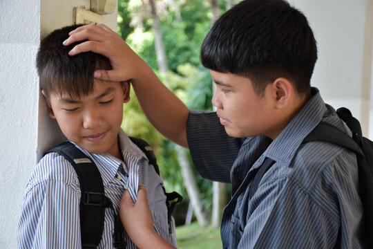 Soft focus of Southeast Asian boys are quarreling and fighting, fights between friends, misunderstandings and mutual forgiveness among friends concept.