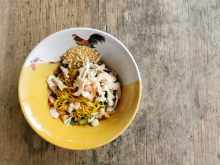 Ba Mee Hang. Thai yellow noodle with shrimp and sliced chicken.