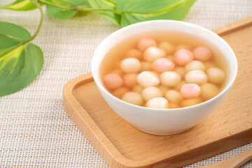 Red and white tangyuan with syrup soup.