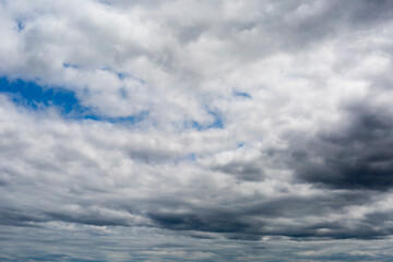 Obraz premium Beautiful clouds during spring time in a Sunny day. Blue sky and white fluffy clouds.