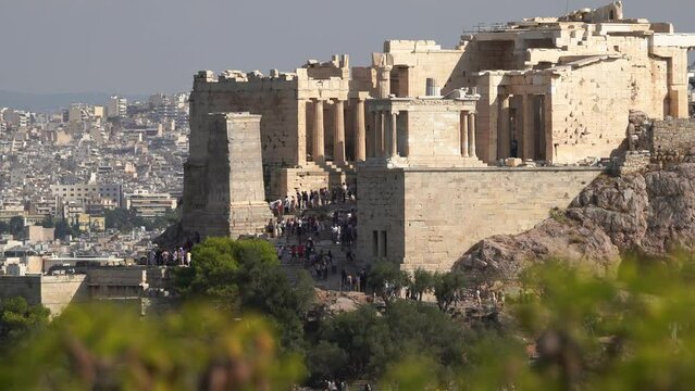 Timelapse of crowded entrance of Acropolis of Athens, Greece. Many tourists in the Parthenon Temple.