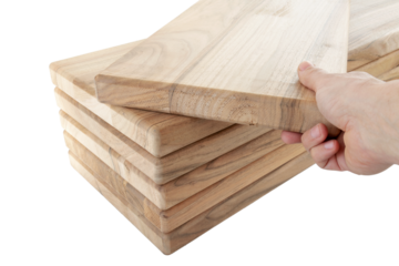 a hand pulls a wooden plank from a stack, steps for a spiral staircase, on an isolated white background