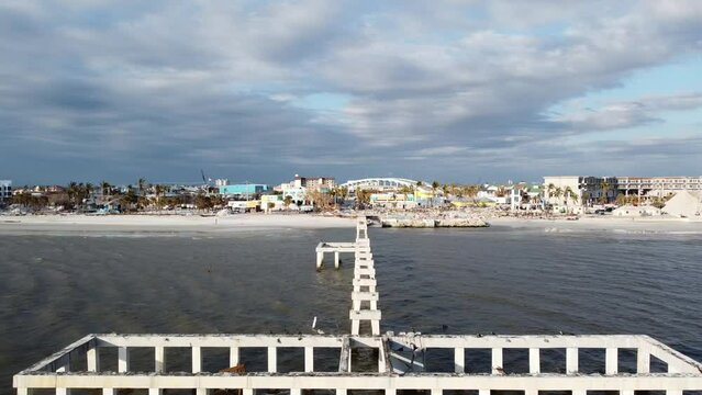 The Times Square area on Fort Myers Beach, FL is mostly reduced to rubble following historic storm surge and winds from Hurricane Ian. 