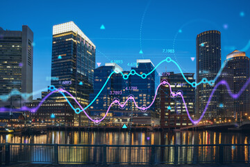 City view panorama of Boston Harbor and Seaport Blvd at night time, Massachusetts. Financial downtown. Glowing FOREX graph hologram. The concept of international trading and fundamental analysis