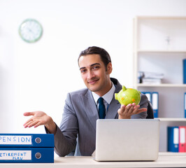 Young male accountant working in the office