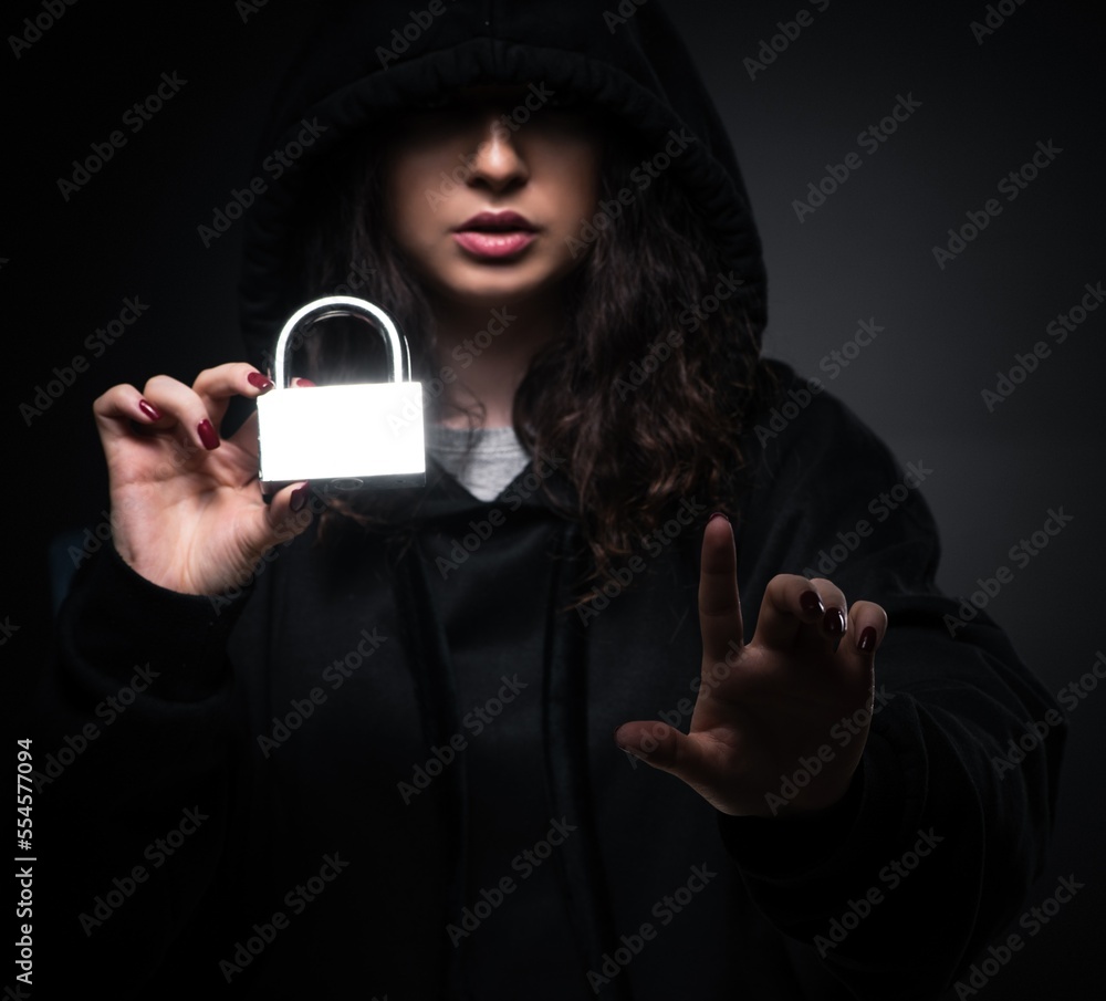 Poster female hacker hacking security firewall late in office