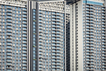 Modern residential condominium facade structure found in Penang in the morning. Urban skyscraper, modern concrete forest.