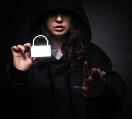 Female hacker hacking security firewall late in office