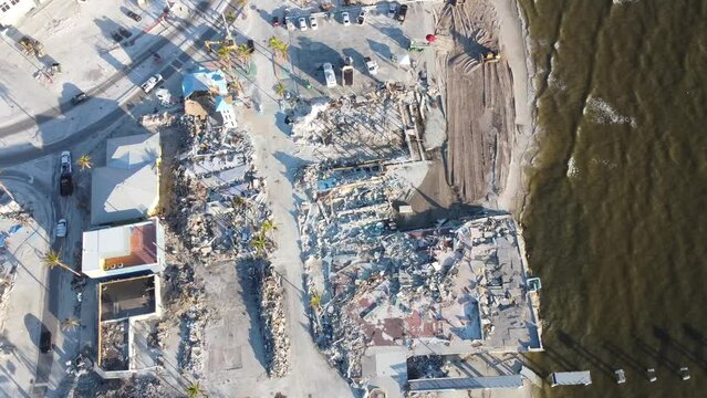 The Times Square area on Fort Myers Beach, FL is mostly reduced to rubble following historic storm surge and winds from Hurricane Ian.