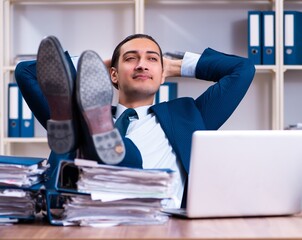 Young handsome businessman working in the office