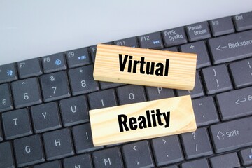 laptop keyboard and wooden board with virtual reality. The concept of using technology today