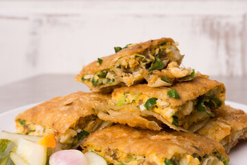 Martabak eggs, Martabak asin or Murtabak, is a popular street food in Indonesia, Asia and the Middle East. is a savory pan-fried pastry stuffed with egg, meat and spices