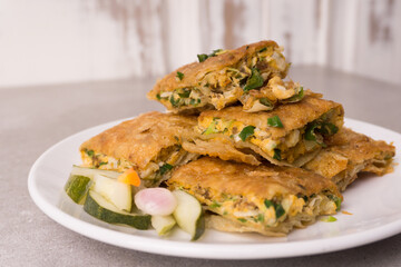 Martabak eggs, Martabak asin or Murtabak, is a popular street food in Indonesia, Asia and the Middle East. is a savory pan-fried pastry stuffed with egg, meat and spices