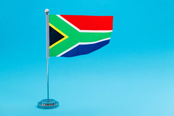 South Africa table flag waving on blue background