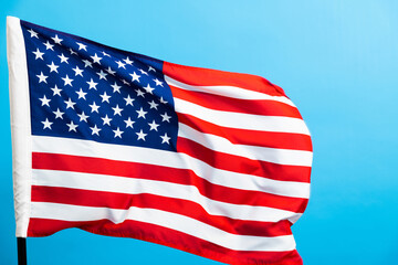 American flag waving on blue background