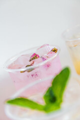 Set of different colors of lemonades and different flavors on a white background and against each other