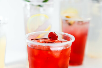 Set of different colors of lemonades and different flavors on a white background and against each other