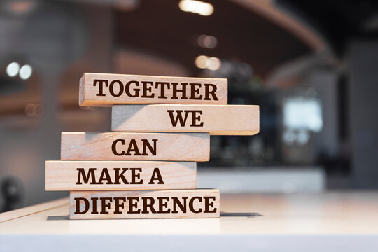 Wooden blocks with words 'Together We Can Make A Difference'.