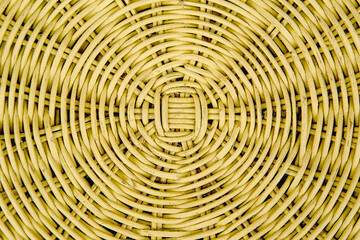 Closed up of yellow color wicker textured background.weaving texture of wicker baskets texture Wicker woven pattern for abstract background . Closeup of beige basket