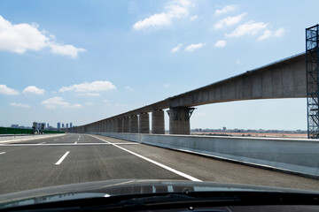 Car driving on bridge highway road