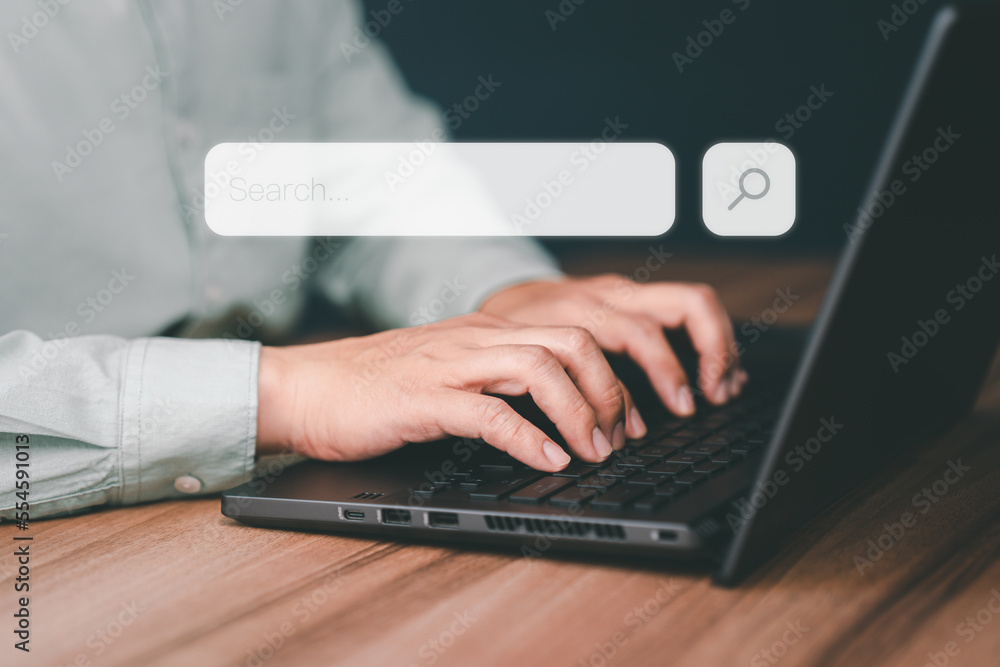 Poster Businessman's hand working with computer laptop on desk in home. Searching Browsing Internet Data Information with blank search bar. Search Engine Optimization SEO Networking Concept.