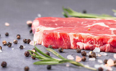 Fresh beef steak on a concrete background