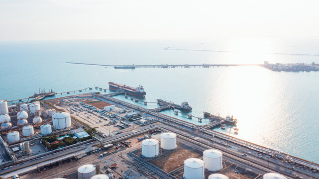 Aerial Top View oil tanker loading dock of business logistic sea going ship, Oil tanker lpg ngv at night / Group Oil tanker to Port of Singapore - Cargo ship import export	