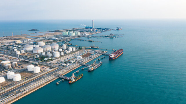 Aerial Top View oil tanker loading dock of business logistic sea going ship, Oil tanker lpg ngv at night / Group Oil tanker to Port of Singapore - Cargo ship import export