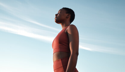 Fitness, meditation and woman on blue sky to breathe fresh air, freedom and energy to exercise, workout and do yoga or cardio training outdoor in nature. Black female take breath for mental health - obrazy, fototapety, plakaty