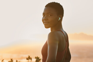 Portrait, black woman and fitness training with music, healthy workout or exercise in sunset....