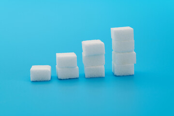 Sugar cubes chart on blue background