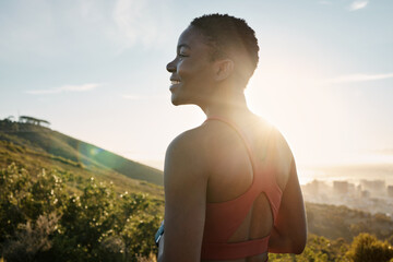 Happy black woman, fitness and thinking in nature, mountains and sunshine flare for motivation,...