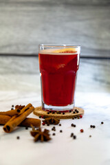 Mulled wine with cinnamon, star anise and spices in glass glasses