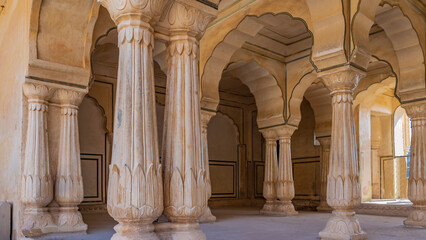 Architecture of the inner hall Amber Fort. High columns with elegant carvings and decorative...
