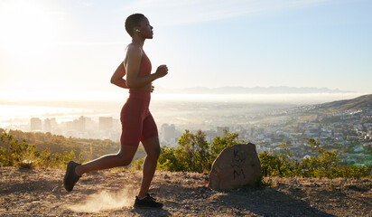 Woman, runner and fitness on mountain with music for wellness workout or cardio training with audio...