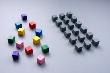 Lines of gray cubes and colored. The concept of inclusion.