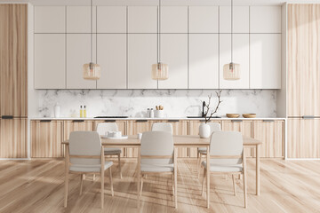 Fototapeta na wymiar Front view on bright kitchen room interior with dining table