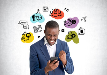 African American businessman in formal suit holding smartphone near sketch