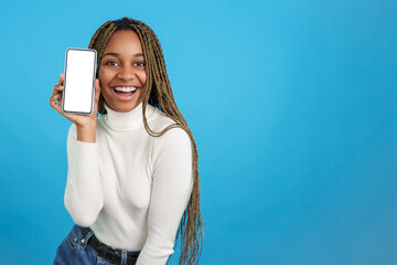 Happy african woman showing a mobile screen