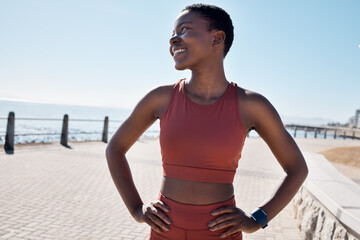 Happy, fitness and black woman on the promenade for running, cardio exercise and idea for sports in Australia. Vision, smile and African runner training for a marathon, race or health by the ocean