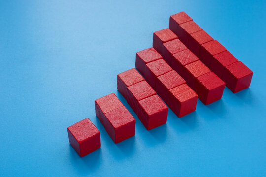 A Pyramid from red cubes. Scalability concept.